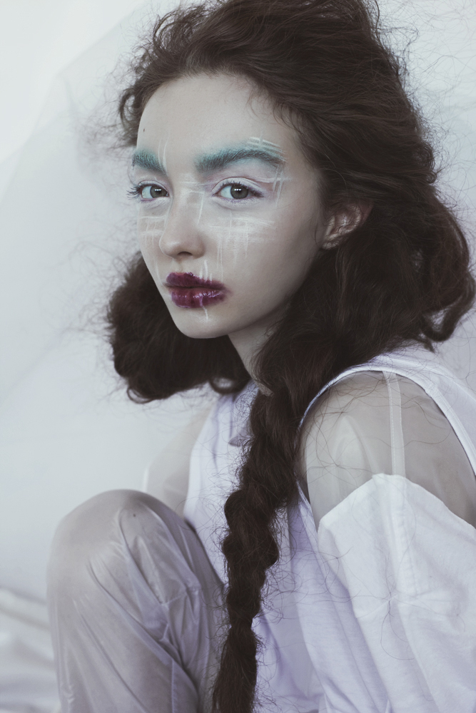 a white flower stained with blood - marta bevacqua